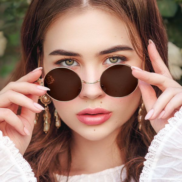 woman wearing sun glasses with a Vintage Letter SpecTats design