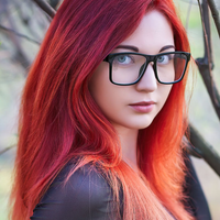 woman wearing clear glasses with a Wiccan SpecTats design